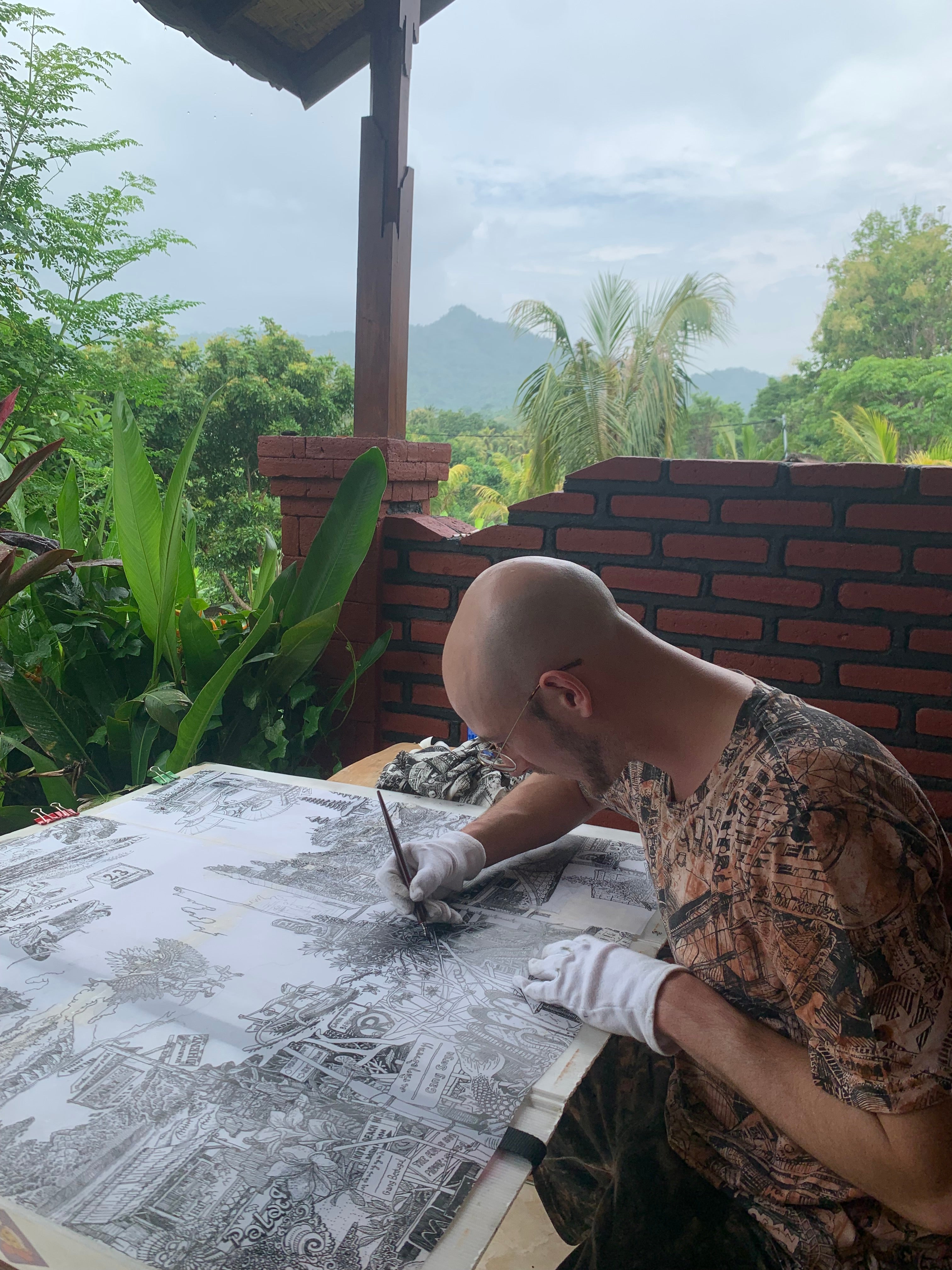 artist drawing live in Bali, using ink and fountain pen, handdrawn bali black and white, bali artwork souvenir